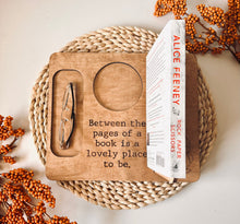 Load image into Gallery viewer, &quot;Between the Pages&quot; sitting with a book
